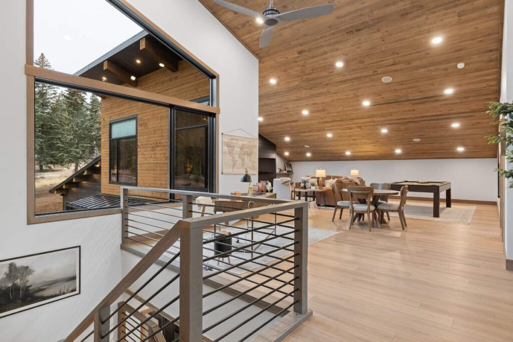 Modern exterior detail with wood and black siding and large window design
